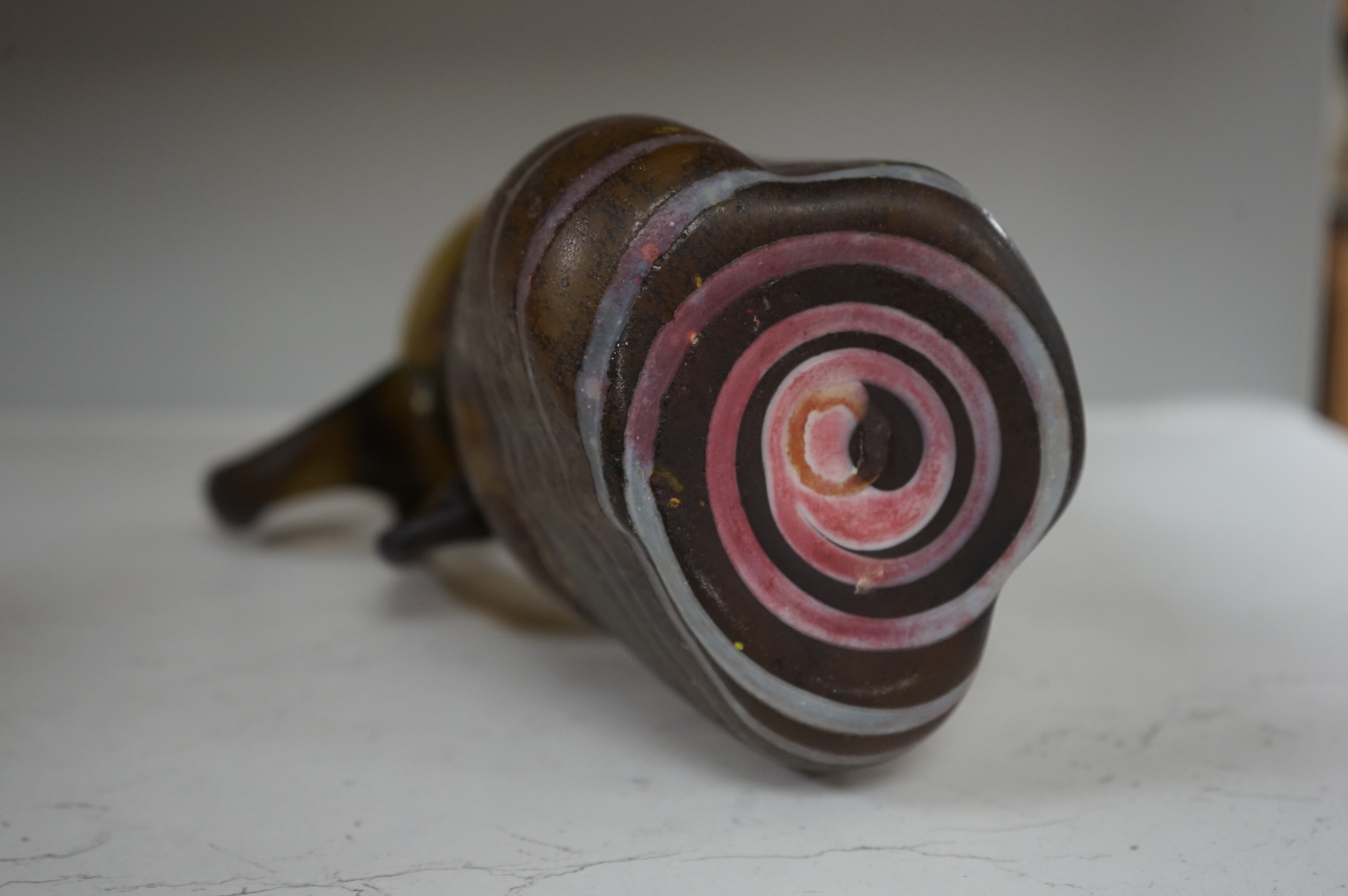 A Roman-type amber and trailed glass ewer with applied roundel, 29cm high. Condition - good